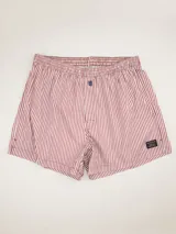 Boxer de algodón azul marino con estampado de bicicletas rojas y logo de la marca bordado en rojo.