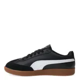 Championes Puma 9T W, color negro con detalles en blanco y suela color caramelo.