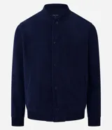 Campera bomber marrón de terciopelo pana con cuello redondo, cierre con botones a presión, bolsillos laterales, puños y cintura elastizados.