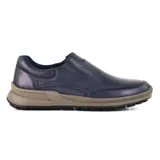 Zapato casual azul marino de cuero liso, con elásticos laterales y suela marrón con detalles en negro.