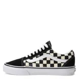 Championes Vans Old Skool unisex, con capellada de gamuza negra en la puntera y talón, laterales de lona con estampado a cuadros blancos y negros, y la clásica sidestripe blanca de cuero en los laterales. Suela de goma blanca con detalle de línea negra.