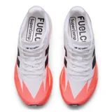 Championes de running New Balance modelo Elite V5, color blanco con detalles en naranja y logo "N" en negro.