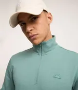Buzo deportivo verde agua para hombre, confeccionado en algodón y poliéster. Cuenta con cuello alto con cremallera, manga larga con ajustes, bolsillo canguro y doble tejido interno.