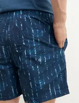 Short de baño azul con estampado abstracto en blanco.