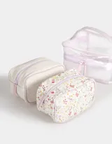 Neceser transparente con estampado floral, con manija superior y doble cierre.