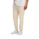 Pantalón de jogging color crema con cordón ajustable en la cintura y logo bordado en la pierna izquierda.