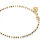 Pulsera con bolas bañada en oro de 18k, con cierre de tipo mosquetón.