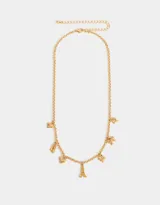 Collar corto dorado con cadena de eslabones y dijes colgantes: moño, zapatos de ballet, corazón y la Torre Eiffel.