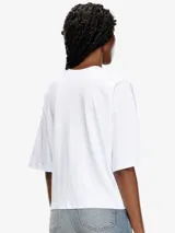 Camiseta oversize blanca de algodón orgánico con logo Diesel ovalado cortado a láser y bordado en el pecho.