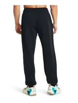 Pantalón de jogging negro de Under Armour Project Rock, corte holgado, con logo de la marca en el muslo izquierdo y cintura elástica con cordón ajustable.