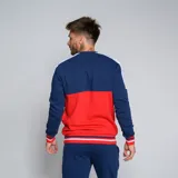 Buzo de cuello redondo Umbro del Club Nacional de Football, modelo Plaqueta CNdeF Oficial para hombre. Diseño con bloques de color azul marino, rojo y blanco. Incluye logo de Umbro y escudo del club en el pecho.
