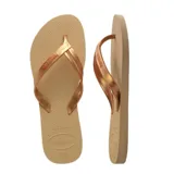 Ojotas Havaianas Elegance color beige con tiras finas doradas.