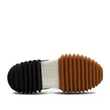 Championes de plataforma en blanco y negro, con diseño innovador y parte superior de lona de algodón orgánico.