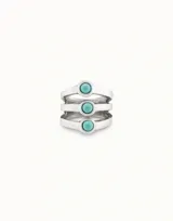 Anillo plateado con tres bandas y tres cristales de murano color turquesa.