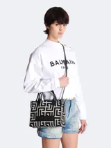 Bolso tote Balmain con monograma B-Army en jacquard blanco y negro, con aplique de cuero con el logo de la marca y asas de mano de cuero.