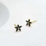 Caravanas en forma de flor de plata 925 bañada en oro de 18k, con zirconias negras.