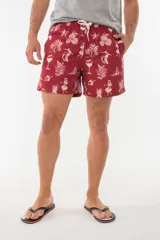 Short de baño azul con estampado de hojas de palmera en tonos azules, blancos y rosados.