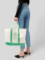 Bolso tote de lona con logotipo bordado en contraste y correas de hombro dobles.