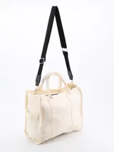 Bolso tipo tote bag color crudo, de tela rígida con doble asa corta y bolsillos laterales.