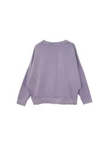 Buzo oversized de algodón lavado, con manga larga y cuello redondo.