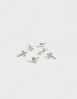 Set de tres pares de aros pasantes bañados en plata: un par con strass redondo, un par con forma de cruz con strass y un par con strass cuadrado.