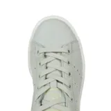 Championes Adidas Stan Smith color verde agua con detalles en verde claro en el talón y suela blanca.