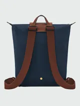 Mochila Longchamp modelo Le Pliage Original M, color crudo con detalles en cuero marrón.