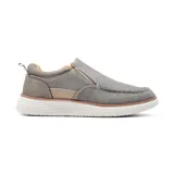 Zapato casual gris sin cordones, con elástico en los laterales y suela blanca.