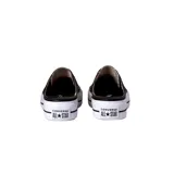 Zapatilla muler con plataforma, color negro, de diseño clásico con suela blanca y detalle en la parte frontal.