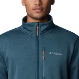 Campera polar Columbia Park View Fleece, color azul jaspeado, con cierre frontal completo, cuello alto, bolsillos laterales con cierre y bolsillo en el pecho con cierre vertical en color verde lima. Cuenta con tecnología Omni-Wick, puños elásticos con orificios para pulgares y protector de barbilla.
