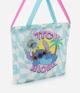Bolso tipo shopper plegable con estampado del personaje de Disney, Stitch, en la playa. Tiene doble asa contrastante en color celeste y rosa.