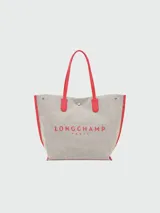 Bolso shopper Longchamp modelo Le Roseau Essential, tamaño L, color crudo con detalles en rojo y logo de jinete bordado.
