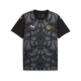 Camiseta de fútbol Puma del Club Atlético Peñarol, modelo teamUltimate. Diseño negro con estampado geométrico en gris y escudo del club en el pecho. Logo de Puma en blanco en el pecho y las mangas.