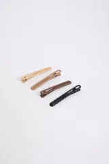 Set de cuatro broches para el cabello en tonos marrones, con diseño de ondas.