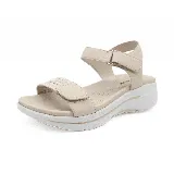 Sandalias negras con plataforma blanca y ajuste con velcro.