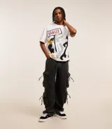 Remera blanca de algodón con estampado de Bugs Bunny, Pato Lucas y Silvestre.