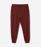 Pantalón deportivo estilo jogger color ladrillo, confeccionado en poliviscosa. Cuenta con cintura ajustable, bolsillos laterales y dobladillo ajustado.