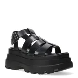 Sandalias franciscanas negras con plataforma chunky y tiras anchas entrecruzadas.