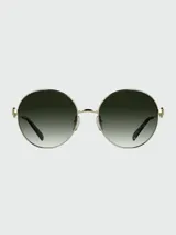 Lentes de sol de metal con forma redonda y lentes degradados en tonos marrones/kaki. La montura es de color bronce oscuro, con un detalle de eslabón ovalado decorativo en la unión del frente con las varillas. Las puntas de las varillas son de acetato en tono traslúcido.