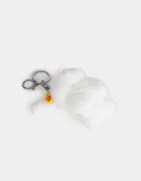 Llavero de peluche blanco con forma de conejo, con accesorios en las orejas y mosquetón metálico para colgar.