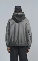 Canguro gris con capucha, de corte oversize y efecto desgastado.