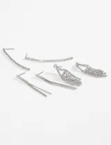 Set de caravanas plateadas con strass, con diferentes diseños colgantes.