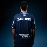 Camiseta de fútbol Umbro del Club Nacional de Football, modelo Away 2, para unisex. Diseño azul marino con detalles en blanco y rojo en cuello y mangas. Incluye logo de Umbro, escudo del club y sponsor Antel en el frente.