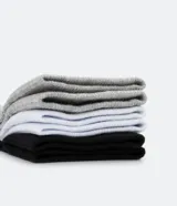 Pack de tres pares de medias cortas deportivas Puma, en color negro, blanco y gris.