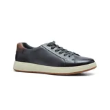 Zapato casual de cuero color marrón con cordones, suela blanca y logo de la marca en el lateral.