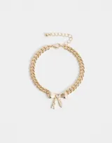 Pulsera dorada de eslabones gruesos con dije de moño con strass.