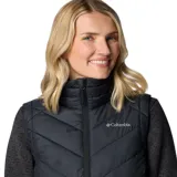 Chaleco acolchado Columbia Heavenly II para mujer, color negro, con forro termorreflectante Omni-Heat™, cuello de felpa forrado de vellón, cierre frontal de dos vías, bolsillos laterales con cremallera y bolsillo interior de seguridad.