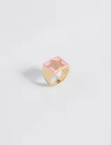 Anillo ajustable de cobre con diseño de estrella, en tonos rosa y dorado.