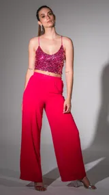 Pantalón palazzo fucsia de gasa, con cintura elástica y corte amplio.