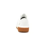Zapatillas urbanas CAT modelo Amp, color blanco con logo en el lateral y suela de goma marrón.